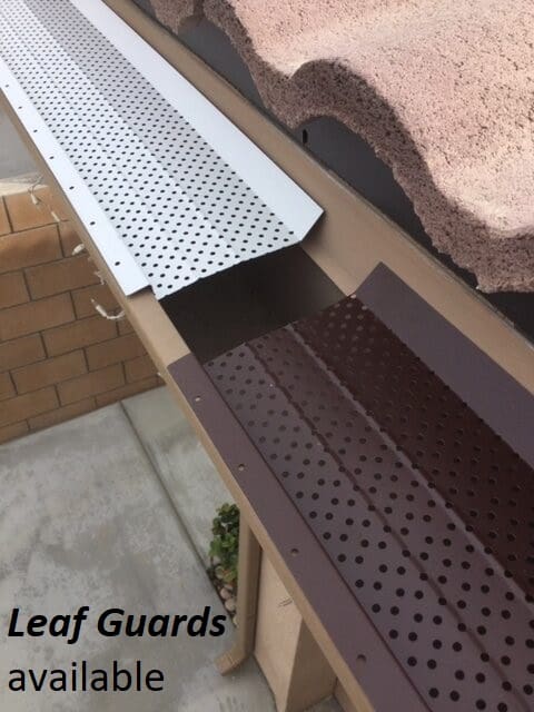 A close up of the gutter guard on a house